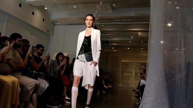 A model presents a creation during the Sao Paulo Fashion Week in Sao Paulo, Brazil on August 28, 2017. (AFP)