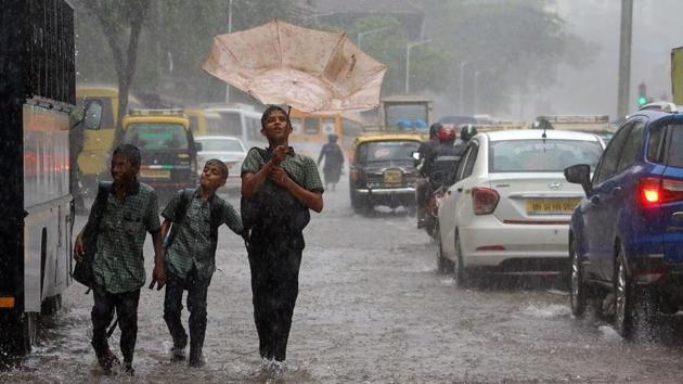 Photos| Mumbai rains: Flights, trains and buses resume as waters recede ...