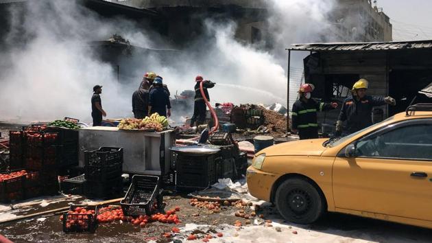 Bulldozers were still trying to clear the area at noon on Monday including clearing two cars that were destroyed in the blast.According to medical sources, members of the security forces were among the victims confirmed in the toll. (Wissm al-Okili/REUTERS)