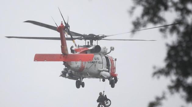A Coast Guard helicopter hoists a wheel chair on board after lifting a person to safety from the area that was inundated with flooding from Hurricane Harvey in Houston, Texas. Harvey, which made landfall north of Corpus Christi late Friday evening, is expected to dump upwards to 40 inches of rain in Texas over the next couple of days. (Joe Raedle/ AFP) A Coast Guard helicopter hoists a wheel chair on board after lifting a person to safety from the area that was inundated with flooding from Hurricane Harvey in Houston, Texas. Harvey, which made landfall north of Corpus Christi late Friday evening, is expected to dump upwards to 40 inches of rain in Texas over the next couple of days. (Joe Raedle/ AFP)