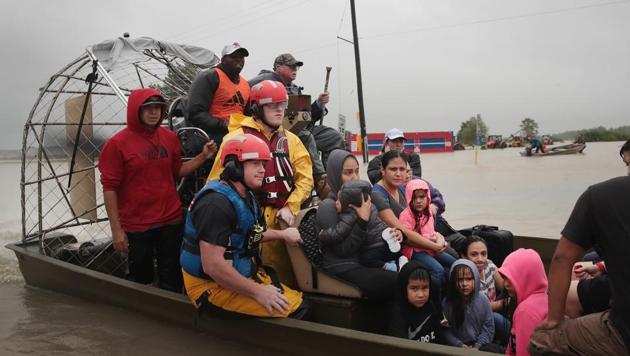 People are rescued from a flooded neighborhood after it was inundated with rain water, remnants of Hurricane Harvey, on August 28, 2017 in Houston, Texas. (AFP Photo) People are rescued from a flooded neighborhood after it was inundated with rain water, remnants of Hurricane Harvey, on August 28, 2017 in Houston, Texas. (AFP Photo)