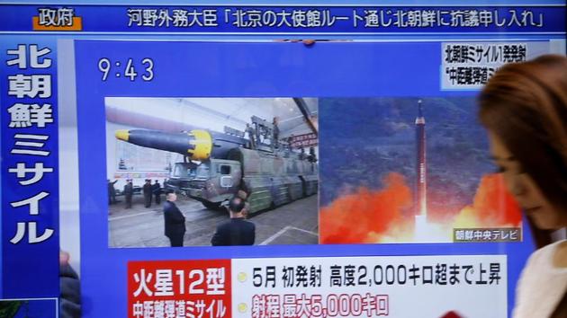 A woman walks past a TV screen broadcasting news of North Korea's missile launch, in Tokyo, Tuesday, Aug. 29, 2017.(AP Photo)