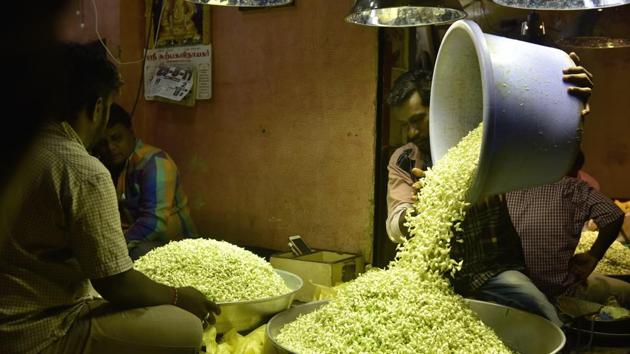 The flower market is divided into two sections. In one part, the traders sell loose flowers such as Marigold, local open roses and garlands for religious purposes. The other section sells more premium quality exotic flowers such as Dutch roses, carnations, oriental lilies, chrysanthemums, orchids and anthuriums among others.  (Arijit Sen/HT Photo) 