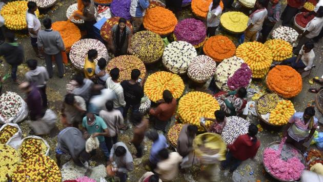 As the festive season picks up with Ganesh Chaturthi, demand and supply for flowers across India rises with people swarming markets and traders anticipating greater returns for their harvests. The K.R market flower market in Bangalore with its vibrant petals, overwhelming the air with the aroma of roses, gerbera, carnations, lilies and anthuriums is a sight to behold. The flower market also vies for the title of being the largest of its kind in Asia. (Arijit Sen/HT Photo) 
