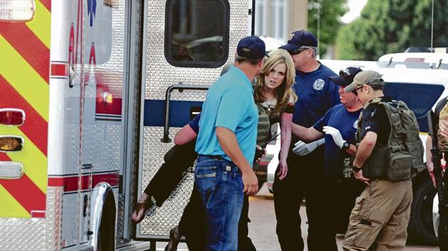 An injured woman is carried to an ambulance in Clovis, N.M., Monday, Aug. 28, 2017, as authorities respond to reports of a shooting inside a public library. A city official says police have taken a person into custody who they believe is responsible for a shooting at the library. (AP Photo) An injured woman is carried to an ambulance in Clovis, N.M., Monday, Aug. 28, 2017, as authorities respond to reports of a shooting inside a public library. A city official says police have taken a person into custody who they believe is responsible for a shooting at the library. (AP Photo)