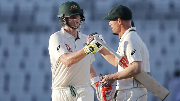 Australian cricket team captain Steve Smith and David Warner greet each other after end of the third day of the first Test against Bangladesh. (AP) Australian cricket team captain Steve Smith and David Warner greet each other after end of the third day of the first Test against Bangladesh. (AP)