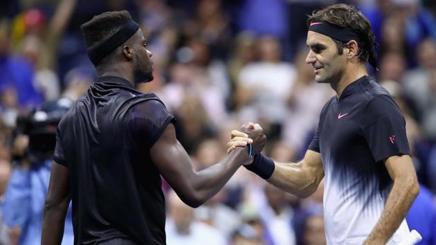 Frances Tiafoe congratulates Roger Federer of Switzerland after their match on Day Two of the 2017 US Open. (AFP)