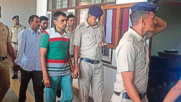 Dera chief’s private securitymen, who were arrested, being produced before a duty magistrate. (HT File) Dera chief’s private securitymen, who were arrested, being produced before a duty magistrate. (HT File)