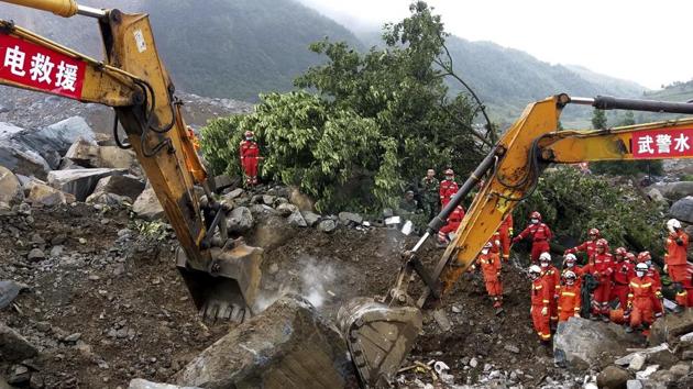 Rescuers work at the site of a landslide in Nayong county in southwest China's Guizhou province, Tuesday, Aug. 29, 2017. The landslide buried dozens of homes in southern China, the local government said. (AP) Rescuers work at the site of a landslide in Nayong county in southwest China's Guizhou province, Tuesday, Aug. 29, 2017. The landslide buried dozens of homes in southern China, the local government said. (AP)