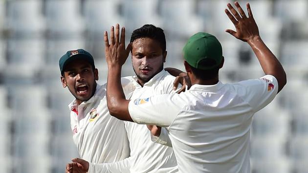 Shakib Al Hasan (C) celebrates with his teammate Mehedi Hasan (L) after the dismissal of Usman Khawaja during the first Test between Bangladesh and Australia. (AFP) Shakib Al Hasan (C) celebrates with his teammate Mehedi Hasan (L) after the dismissal of Usman Khawaja during the first Test between Bangladesh and Australia. (AFP)