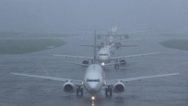 Flights were lined up to take off despite heavy rains in Mumbai yesterday. As of Wednesday flight services are slowly resuming as airport staff arrive. Helicopter operations have resumed at Juhu aerodrome. Navi Mumbai Municipal Transport is running 55 extra buses to ferry people from satellite towns while traffic remains slow. (Pramod Thakur / HT PHOTO) Flights were lined up to take off despite heavy rains in Mumbai yesterday. As of Wednesday flight services are slowly resuming as airport staff arrive. Helicopter operations have resumed at Juhu aerodrome. Navi Mumbai Municipal Transport is running 55 extra buses to ferry people from satellite towns while traffic remains slow. (Pramod Thakur / HT PHOTO)