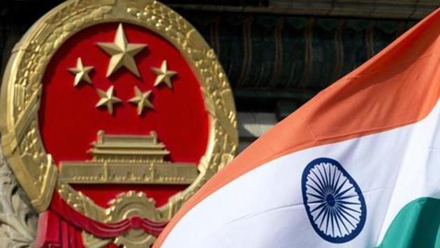 In this file photo, an Indian national flag is seen next to the Chinese national emblem during a welcome ceremony for visiting Indian officials outside the Great Hall of the People in Beijing. (AP) In this file photo, an Indian national flag is seen next to the Chinese national emblem during a welcome ceremony for visiting Indian officials outside the Great Hall of the People in Beijing. (AP)