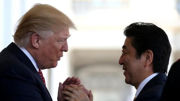 Japanese Prime Minister Shinzo Abe (R) is greeted by US President Donald Trump at the White House in Washington, in February.(Reuters file) Japanese Prime Minister Shinzo Abe (R) is greeted by US President Donald Trump at the White House in Washington, in February.(Reuters file)