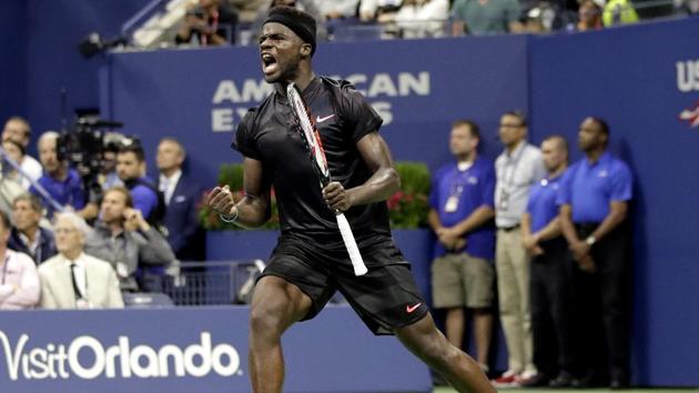 Frances Tiafoe reacts after breaking Roger Federer during the US Open first-round encounter. (AP)