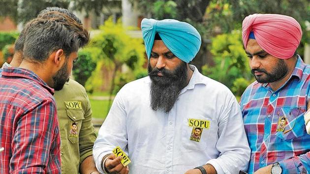 Candidates using printed stickers for canvassing at Panjab University, Chandigarh, on Wednesday. (Karun Sharma/HT) Candidates using printed stickers for canvassing at Panjab University, Chandigarh, on Wednesday. (Karun Sharma/HT)