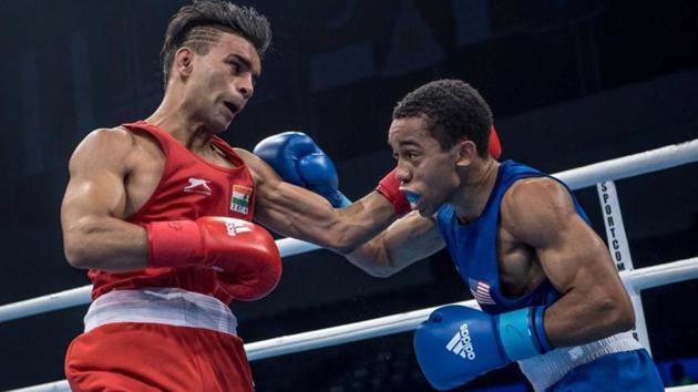 Gaurav Bidhuri in action against Duke Ragan of the US during their bantamweight semifinal bout at the AIBA World Boxing Championships in Hamburg on Thursday. (AIBA) Gaurav Bidhuri in action against Duke Ragan of the US during their bantamweight semifinal bout at the AIBA World Boxing Championships in Hamburg on Thursday. (AIBA)