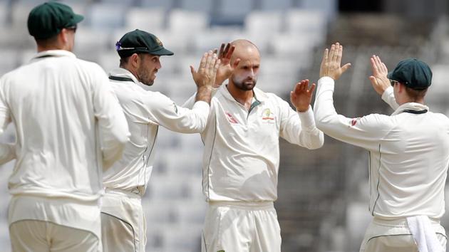 Australia's Nathan Lyon, second right, celebrates with teammates during the first Test against Bangladesh. (AP) Australia's Nathan Lyon, second right, celebrates with teammates during the first Test against Bangladesh. (AP)