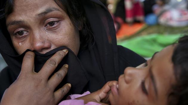 A Rohingya woman breaks down after being stopped by Bangladeshi border guards at a makeshift shelter at Ghumdhum, Bangladesh. The United Nations while condemning the militant attacks has pressured Myanmar to protect civilian lives without discrimination and appealed to Bangladesh to admit those fleeing the military counteroffensive. (Mushfiqul Alam / AP) A Rohingya woman breaks down after being stopped by Bangladeshi border guards at a makeshift shelter at Ghumdhum, Bangladesh. The United Nations while condemning the militant attacks has pressured Myanmar to protect civilian lives without discrimination and appealed to Bangladesh to admit those fleeing the military counteroffensive. (Mushfiqul Alam / AP)