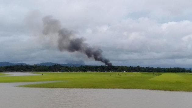 Plumes of smoke billowed from several burning villages in the worst-hit section of the state after clashes began on Friday in which militants from Arakan Rohingya Salvation Army staged deadly surprise raids on police posts. At least 110 people, including 11 state officials, have been confirmed dead and thousands of Rohingya have rushed to the border with Bangladesh despite Dhaka’s attempts to stop them. (Sam Jahan / AFP) Plumes of smoke billowed from several burning villages in the worst-hit section of the state after clashes began on Friday in which militants from Arakan Rohingya Salvation Army staged deadly surprise raids on police posts. At least 110 people, including 11 state officials, have been confirmed dead and thousands of Rohingya have rushed to the border with Bangladesh despite Dhaka’s attempts to stop them. (Sam Jahan / AFP)