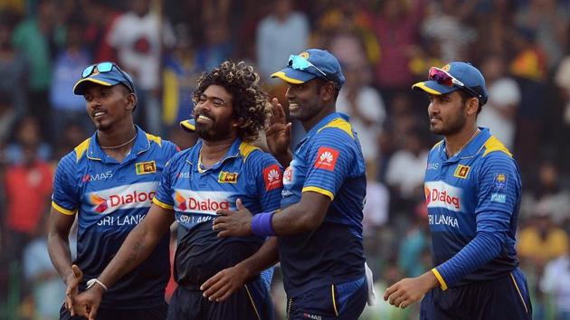Lasith Malinga (C), Sri Lanka’s stand-in skipper, removed Kohli to complete 300 ODI wickets. (AFP)