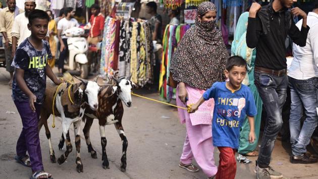 Men and women dress for the occasion and offer congregational prayers on the day of Eid in an open field or a mosque. The meat of the slaughtered animal is equally distributed into three halves among family members, relatives and as charity among the poor. (Burhaan Kinu/HT PHOTO)