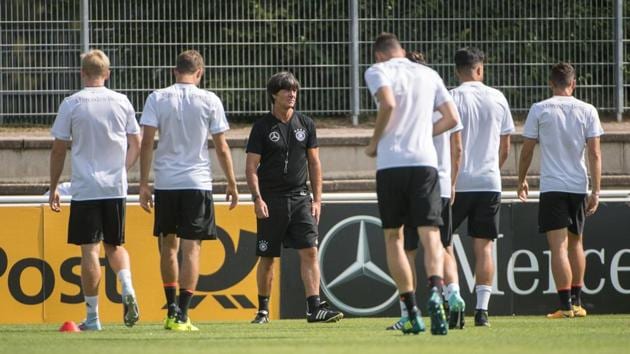 Joachim Loew (C) looks on during a training session of the German national football team ahead of the FIFA World Cup 2018. (AFP) Joachim Loew (C) looks on during a training session of the German national football team ahead of the FIFA World Cup 2018. (AFP)