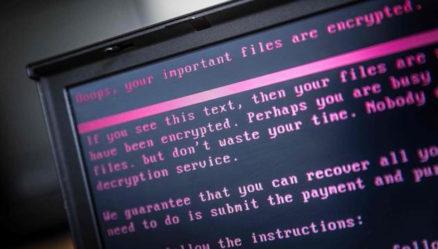 A laptop displays a message after being infected by a ransomware as part of a worldwide cyberattack on June 27 in Geldrop. (AFP File Photo) A laptop displays a message after being infected by a ransomware as part of a worldwide cyberattack on June 27 in Geldrop. (AFP File Photo)