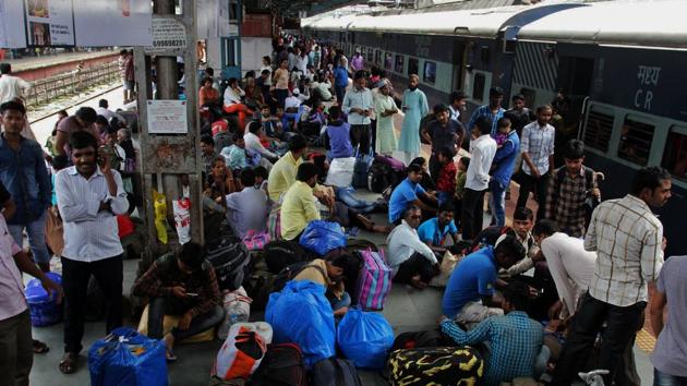 Stranded commuters at Thane on Wednesday. (Praful Gangurde) Stranded commuters at Thane on Wednesday. (Praful Gangurde)