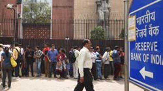 People wait outside the RBI in New Delhi to deposit their demonetised banknotes in exchange for legal tender on the last day of the deadline in New Delhi, on March 31, 2017.(Ravi Choudhary/HT File Photo)