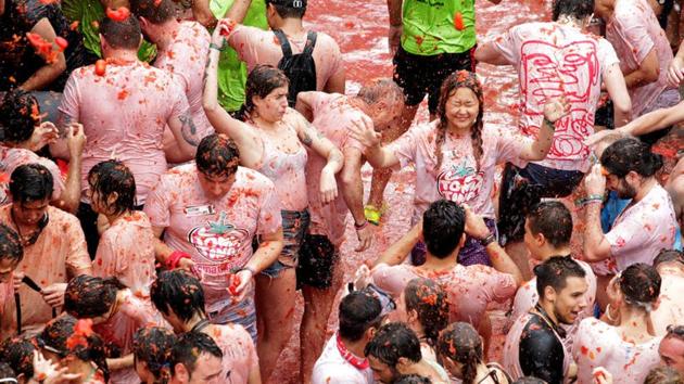 There are various theories which includes that it began with local food fight among friends, a practical joke on a bad musician, a volley of tomatoes from bystanders at a carnival parade and many more. (Heino Kalis / REUTERS)