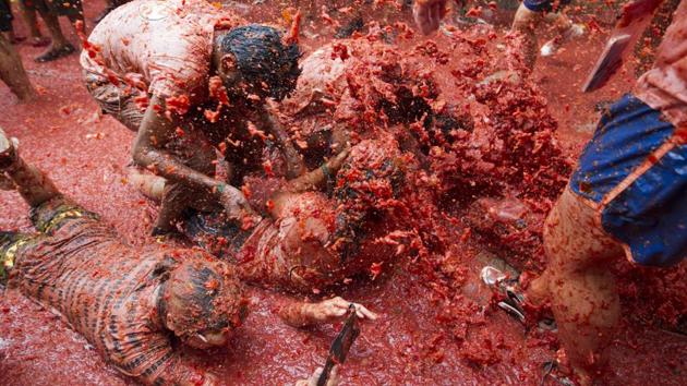 Without knowing the origin of the tradition, it has kept repeating year after year as it is enjoyed so much. As said to be ‘the world’s biggest food fight’, this iconic food fiesta celebrates its 72nd anniversary and has become a major draw for foreigners particularly from the United States, Britain and Japan. (JAIME REINA / AFP)