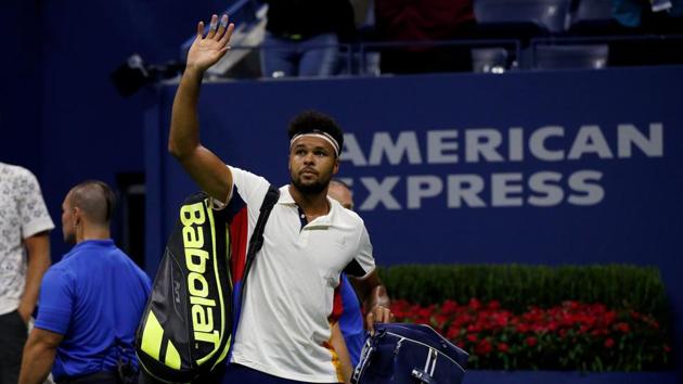 Jo-Wilfried Tsonga of France exits Arthur Ashe Stadium after his second round defeat against Denis Shapovalov. (REUTERS)