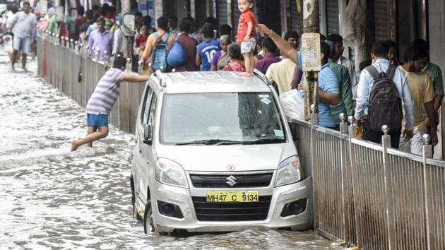 A car stuck at Lower Parel on Wednesday. (Kunal Patil/H) A car stuck at Lower Parel on Wednesday. (Kunal Patil/H)