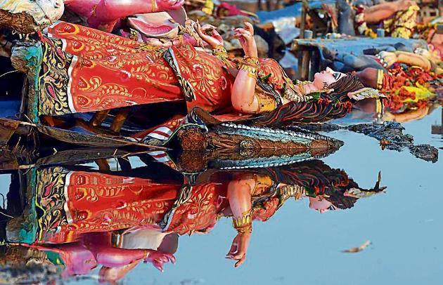 Durga Puja pandals in Chittaranjan Park will immerse Durga idols in artificial ponds instead of Yamuna this year. The National Green Tribunal in 2015 had banned immersion of idols made from non-biodegradable material such as quick-setting gypsum plaster, also known as Plaster of Paris, or plastic in the Yamuna. (Ravi Choudhary/HT Photo) Durga Puja pandals in Chittaranjan Park will immerse Durga idols in artificial ponds instead of Yamuna this year. The National Green Tribunal in 2015 had banned immersion of idols made from non-biodegradable material such as quick-setting gypsum plaster, also known as Plaster of Paris, or plastic in the Yamuna. (Ravi Choudhary/HT Photo)