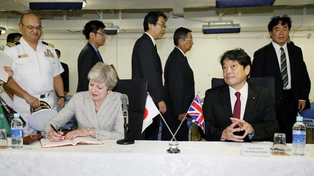 Britain's Prime Minister Theresa May (sitting L), flanked by Japan's Defense Minister Itsunori Onodera (sitting R), signs the register book as she inspects Japan's Maritime Self-Defense Force (JMSDF)'s biggest warship Izumo at JMSDF Yokosuka base in Yokosuka, south of Tokyo, Japan. (REUTERS Photo) Britain's Prime Minister Theresa May (sitting L), flanked by Japan's Defense Minister Itsunori Onodera (sitting R), signs the register book as she inspects Japan's Maritime Self-Defense Force (JMSDF)'s biggest warship Izumo at JMSDF Yokosuka base in Yokosuka, south of Tokyo, Japan. (REUTERS Photo)