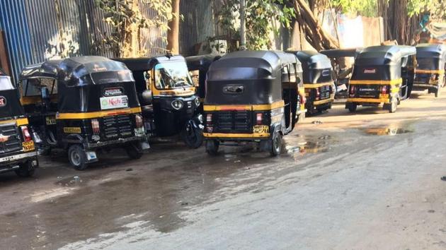 Auto illegally parked on the road leading to Versova beach.