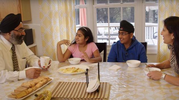 A still from an ad showing a Sikh American family dining together.(Source: Youtube)