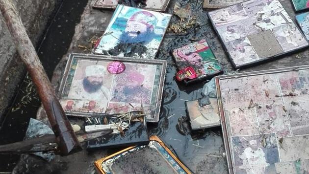 The drains were clogged by hundreds of photos of Gurmeet Ram Rahim Singh, now in jail after being convicted of twin rapes.(HT photo)