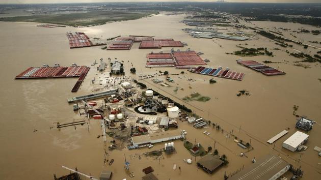In this Aug. 30, 2017, photo, barges are secured by tugboats in the flood-swollen Burnet Bay along the Houston Ship Channel in Houston. (AP) In this Aug. 30, 2017, photo, barges are secured by tugboats in the flood-swollen Burnet Bay along the Houston Ship Channel in Houston. (AP)