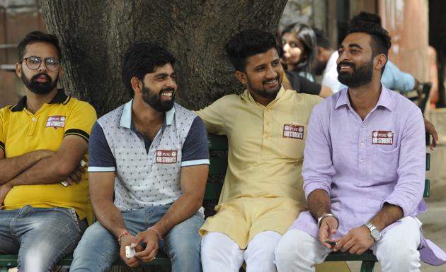 Many parties use fancy stickers and posters printed to attract more supporters. One of the major parties has for 20 different types of stickers for campaigning. Some wear badges while others use handmade stickers. (karun sharma/ht)
