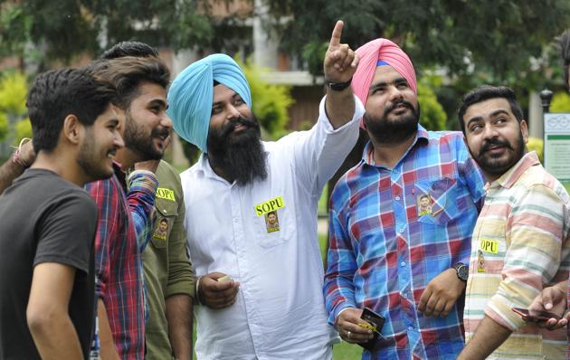 Student council elections at Panjab University have become a canvas of colourful stickers of different parties dotting the ground. Parties distribute them to bring more supporters into their fold. However, this is a clear violation of the Lyngdoh Committee guidelines. (Karun Sharma/ht)