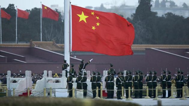 In this March 5, 2016 photo Chinese paramilitary policemen perform a flag raising ceremony on Tiananmen Square in Beijing. (AP File Photo) In this March 5, 2016 photo Chinese paramilitary policemen perform a flag raising ceremony on Tiananmen Square in Beijing. (AP File Photo)