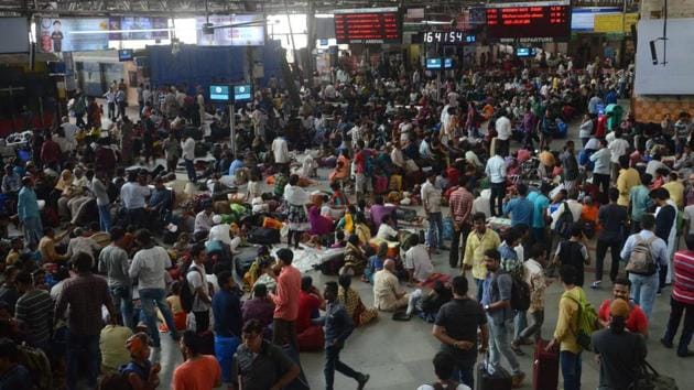 Commuters stranded at CMST during the monsoon.(Bhushan Koyande/HT) Commuters stranded at CMST during the monsoon.(Bhushan Koyande/HT)