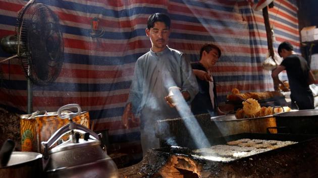Men make traditional Jalebi sweets at a small traditional factory ahead of the Eid al-Adha, in Kabul, Afghanistan. In his celebration address, President Ashraf Ghani called on the Taliban who have been fighting to drive out international forces backing the government and restore strict Islamic rule to Afghanistan to accept peace. (Mohammad Ismail / REUTERS)