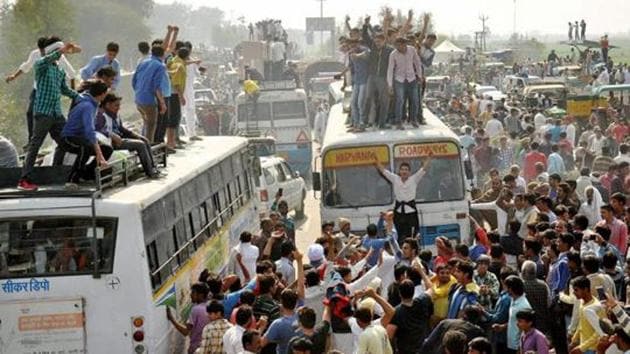 File photo of Jat protesters blocking traffic on the Panipat-Rohtak national highway during their February agitation for reservation in February. (PTI) File photo of Jat protesters blocking traffic on the Panipat-Rohtak national highway during their February agitation for reservation in February. (PTI)