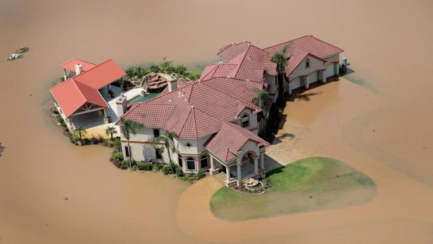 Hurricane Katrina in 2005 is the largest disaster the nation has faced, with recovery costs of $110 billion, according to the Congressional Budget Office. Superstorm Sandy in 2012 was followed by a $54 billion federal relief effort.  (Scott Olson / AFP) 