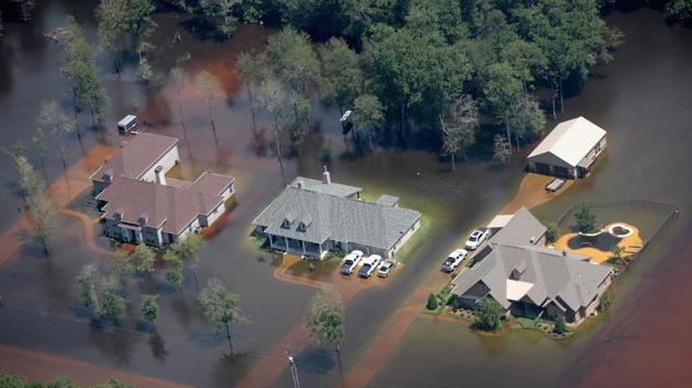 Homes are surrounded by floodwater after torrential rains pounded Southeast Texas following Hurricane and Tropical Storm Harvey on August 31, 2017 in Orange, Texas. (AFP) Homes are surrounded by floodwater after torrential rains pounded Southeast Texas following Hurricane and Tropical Storm Harvey on August 31, 2017 in Orange, Texas. (AFP)