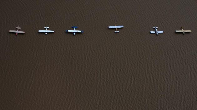 Planes  surrounded by flood waters caused by Tropical Storm Harvey at the West Houston Airport in Texas. Floodwaters affected air services hit by Hurricane Harvey with at least 10,000 flights have been cancelled nationwide. (Adrees Latif  / REUTERS) 