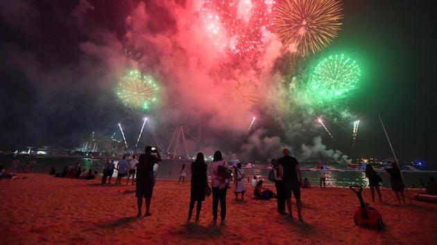 People watch fireworks in Dubai on the eve of the Muslim holiday of Eid al-Adha. (Giuseppe cACACE / AFP)