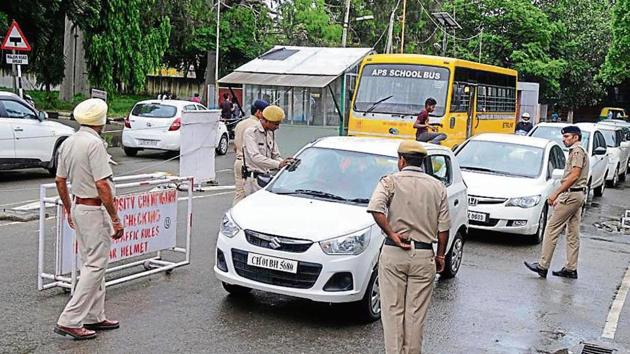 Cops and the PU security staff checking vehicles at an entrance on Friday. (Anil Dayal/HT) Cops and the PU security staff checking vehicles at an entrance on Friday. (Anil Dayal/HT)